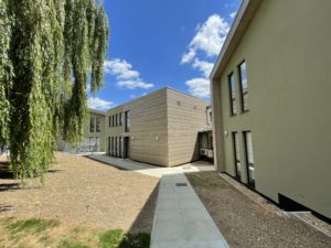 rear view of Gp practice showing garden and willow tree 