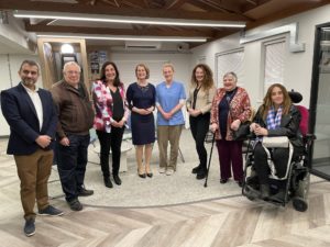 Lead clinical staff, patients and Helen Hayes MP smiling at the official opening of Crown Dale Medical Practice