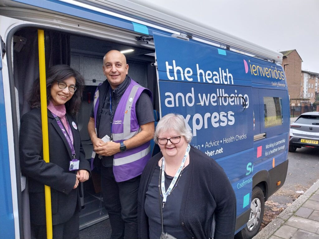 Board members Nozomi Akanuma and Sarah Flanagan with Health Champion Mem at the Health and Wellbeing Bus