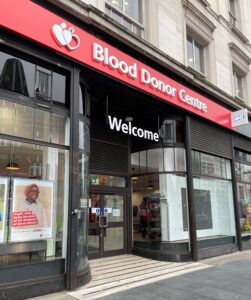 Shop front in Brixton with sign above reading Blood Donor Centre 